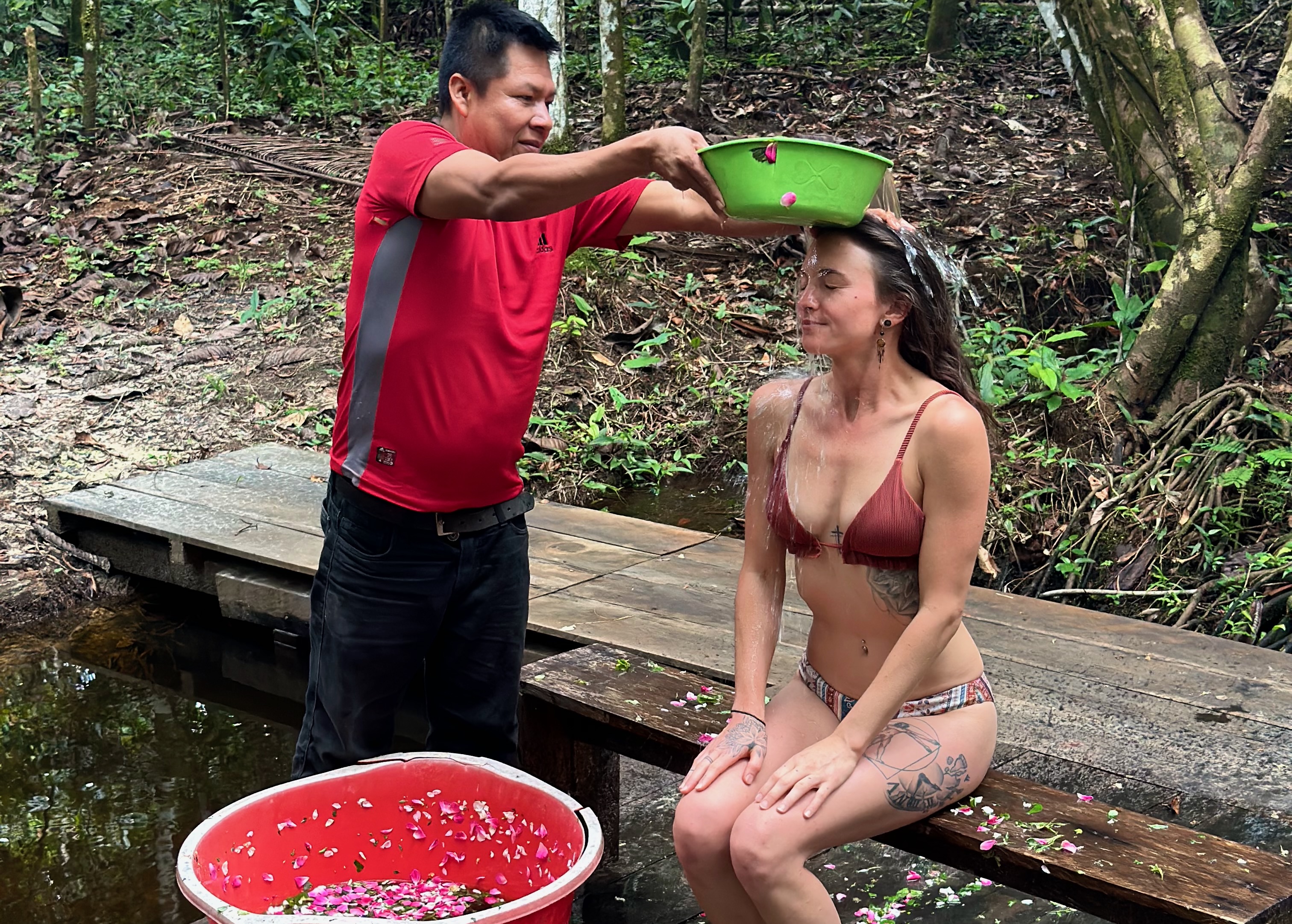 Flower bath ritual by the river